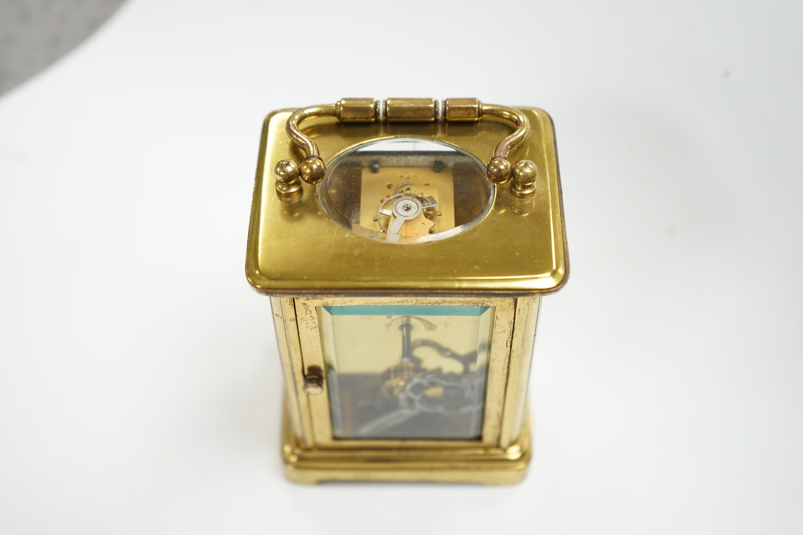 A carriage timepiece, dial stamped Ellington and Co, (with purchase receipt), 10cm high. Condition - case fair, not tested as working